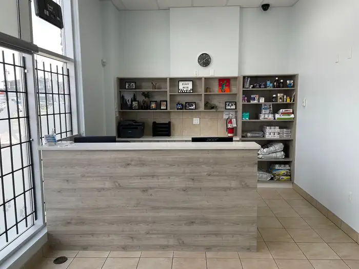 Reception desk and retail shelves at Panorama Hills Animal Hospital