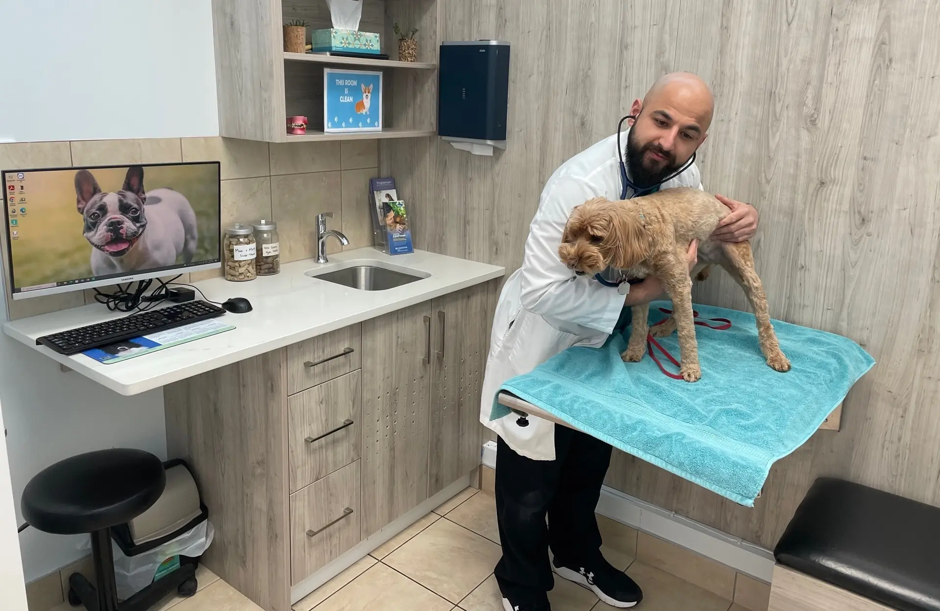 Dr. Manpreet Dhaliwal holding a puppy